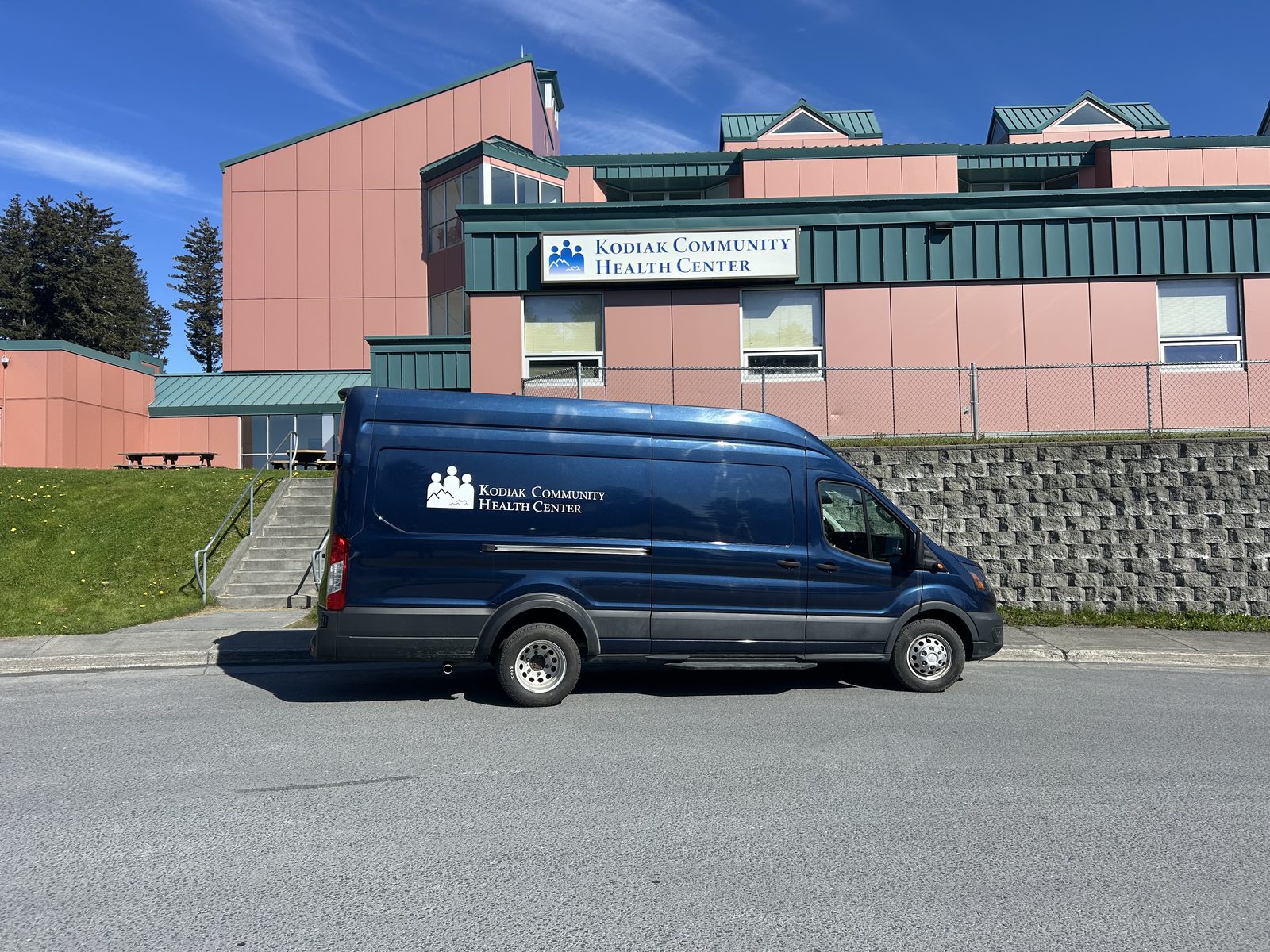 The mobile health unit parked in front of the Kodiak Community Health Center building